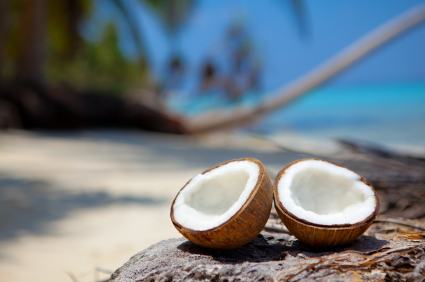 fresh coconut halves on beach